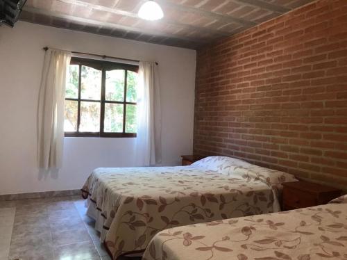 Katil atau katil-katil dalam bilik di Santo Sol Suites