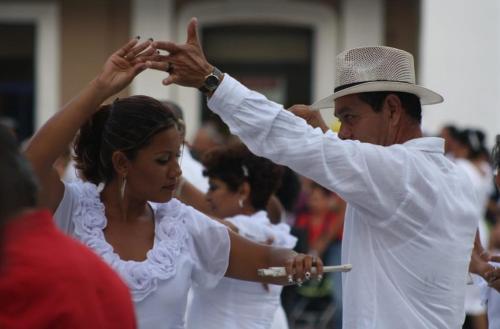a man and a woman in white dancing at Marina Excelsior in Playa del Carmen
