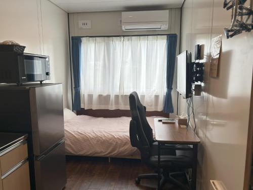 Postel nebo postele na pokoji v ubytování Daigo Kujigawa Base Hotel