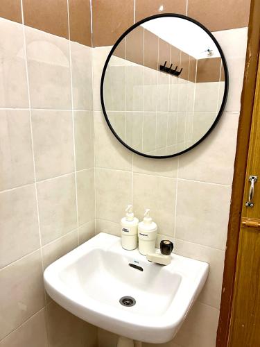 a bathroom with a sink and a mirror at 7 STAY#2 - 1 Room for 3 Pax at Kuala Berang -Best Travelers Stay in Kuala Berang