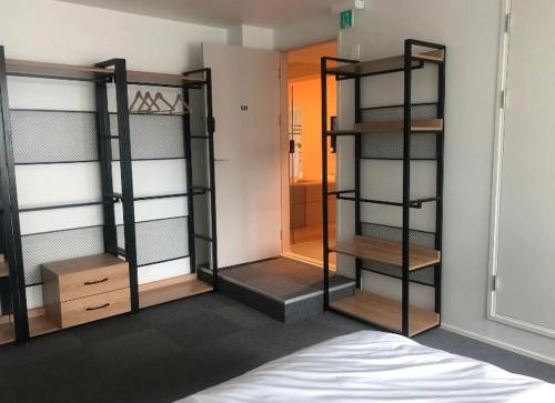 a room with three bunk beds in a room at Urban Bridge Stay U in Busan