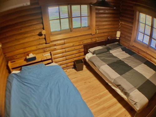 MOTOSUGA Log Houseにあるベッド