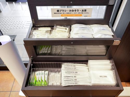 a drawer full of towels in a store at Super Hotel Okazaki in Okazaki