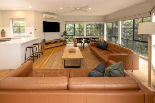a living room with a couch and a table at BIG4 Wye River Holiday Park in Wye River