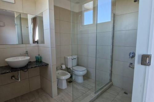 a bathroom with a toilet and a sink and a shower at Tango 4C in Victoria