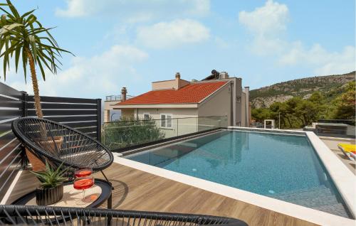 a swimming pool on the roof of a house at Awesome Home In Veliko Brdo With Wifi in Veliko Brdo