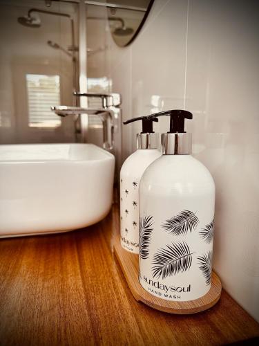 a bathroom with a soap dispenser and a sink at Las Casitas in Donnybrook