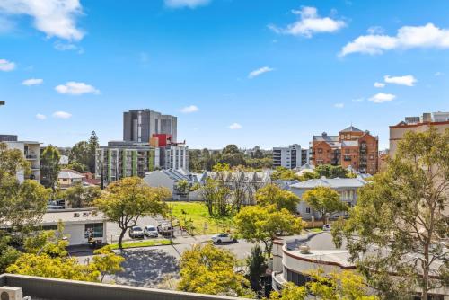 a view of a city with buildings at Cozy 2-Bedroom Apartment with City Views in Perth