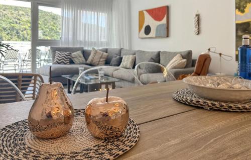 two vases sitting on a table in a living room at Benahavis Village in Benahavís
