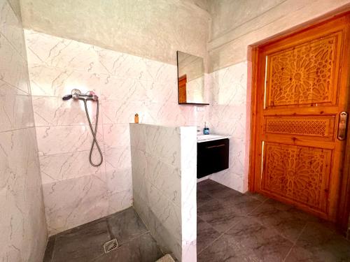 a bathroom with a shower and a sink at Jenny Lynn in Marrakech