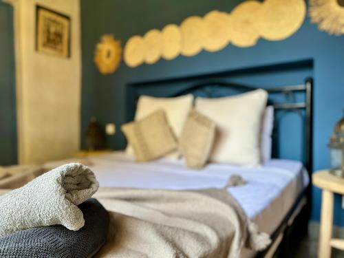 a bedroom with a bed with a stuffed animal on it at Jenny Lynn in Marrakech