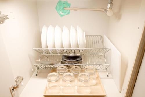 a group of glasses sitting on a shelf in a refrigerator at Mi-APT MIDORI in Tokyo