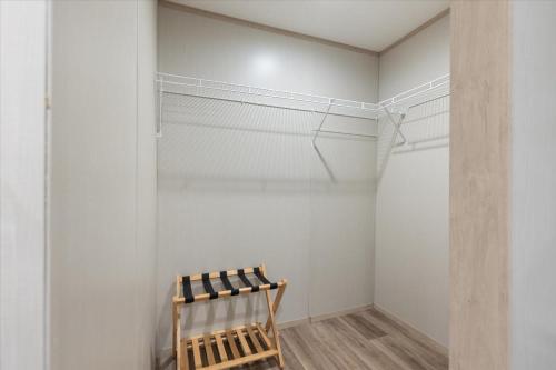 a closet with a wooden chair in a room at Ichetucknee Springs 2 MI - Fire Pit Pavilion & Grill in Fort White