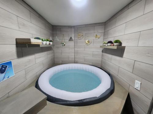 a bathroom with a large bath tub in the corner at Ocean blue in San Felipe