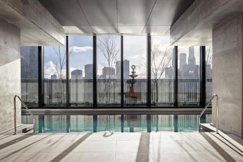 a swimming pool with a view of the city at Urban Rest Southbank in Melbourne