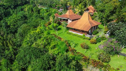 an aerial view of a house with a roof at Shanti Natural Panorama View Hotel in Singaraja