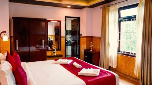 Ένα ή περισσότερα κρεβάτια σε δωμάτιο στο Hotel Tarcon