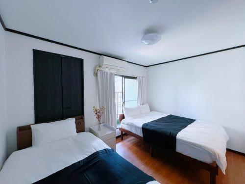 Llit o llits en una habitació de 荣-和inn303