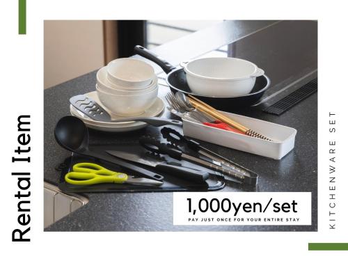 a bunch of kitchen utensils sitting on a counter at Comfort Plus in Chatan