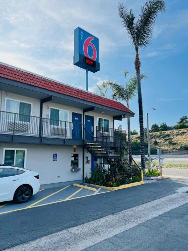 a gas station with a car parked in front of it at Motel 6-La Mesa, CA - San Diego in La Mesa
