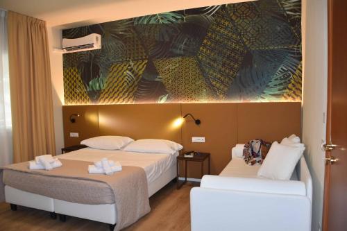 Postel nebo postele na pokoji v ubytování Hotel Suez
