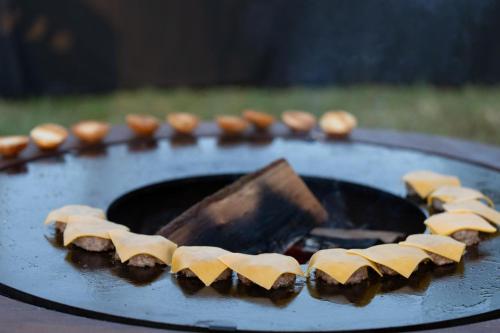 a bunch of food on top of a grill at La Ferme, propriété d'exception in Puygiron