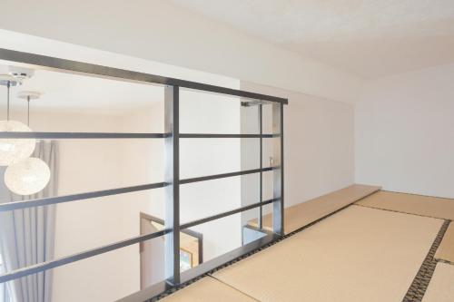 a room with glass walls and a window at 赤樓古巷民宿 6-12人可包棟 in Tainan