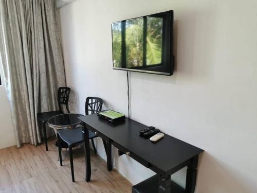 TV a/nebo společenská místnost v ubytování C 23 Lot 10 Pangkor Leisure Beach Studio