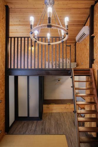 a chandelier in a tiny house at 赤樓古巷民宿 6-12人可包棟 in Tainan