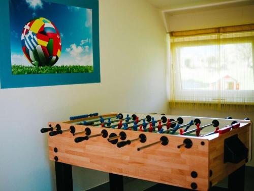 a wooden chess board with a soccer ball in a room at Holiday home in Faak am See in Faak am See