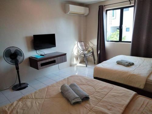 Postel nebo postele na pokoji v ubytování 39 Lot 10 Pangkor Leisure Beach Studio