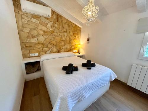Postel nebo postele na pokoji v ubytování Formentera a la Costa Brava amb BBQ i jardí