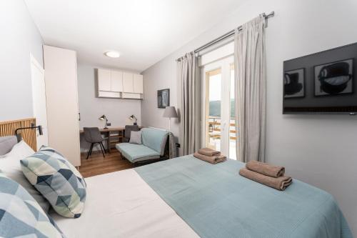 Postel nebo postele na pokoji v ubytování Apartments Palma Rabac