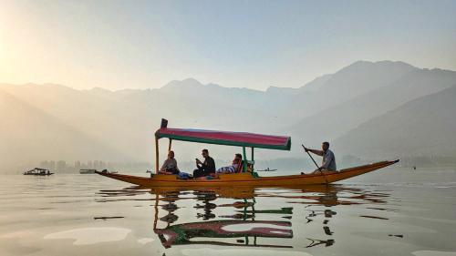 a group of people on a boat on the water at White House Group Of Houseboats in Srinagar