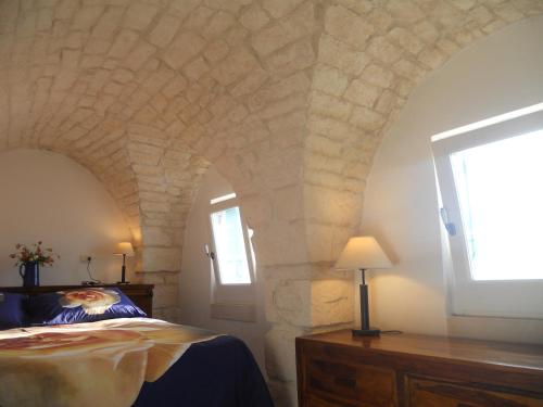 Ένα ή περισσότερα κρεβάτια σε δωμάτιο στο Casa Indipendente Settecentesca AIRCON Wifi Vista Mare