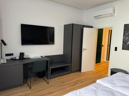 Postel nebo postele na pokoji v ubytování Jan Maria Hotel