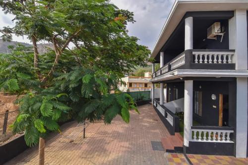 a view of a house with a balcony at Black Stone Villa in Lonavala