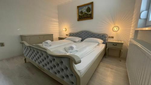 a bedroom with a large bed with towels on it at Holiday Home Leon - Imotski - Makarska in Drum
