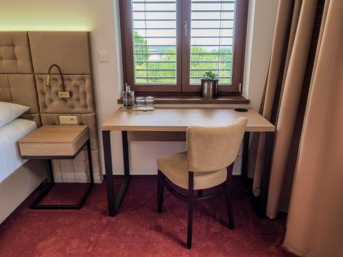 Postel nebo postele na pokoji v ubytování Hotel Cvilín