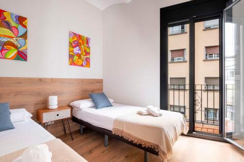 Posteľ alebo postele v izbe v ubytovaní Fira Barcelona Apartment