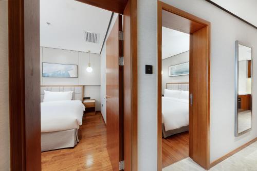 Ένα ή περισσότερα κρεβάτια σε δωμάτιο στο Holiday Inn Suites Xi'an High-Tech Zone by IHG