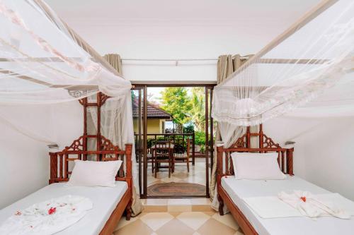 Postel nebo postele na pokoji v ubytování Ifa Beach Resort
