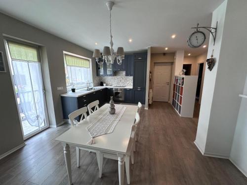 a kitchen and dining room with a table and chairs at A cjase di Luca in Paluzza