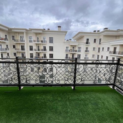 a balcony in front of a large building at Studio in Tashkent City in Tashkent