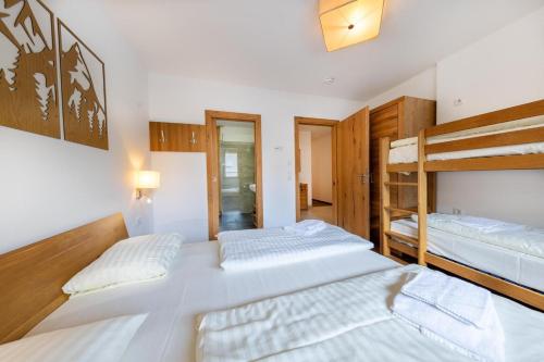 Postel nebo postele na pokoji v ubytování Residenz Wildkogelbahnen Top 5