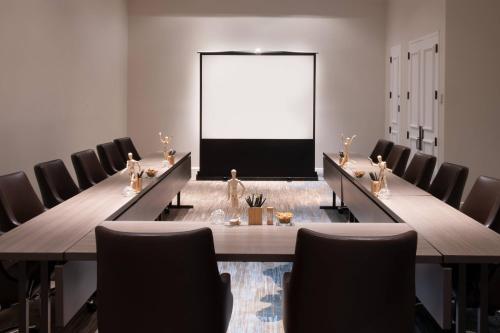 a conference room with a long table and chairs at Renaissance Newport Beach Hotel in Newport Beach