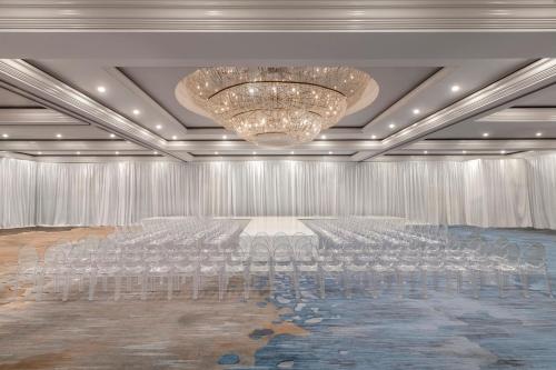 a conference room with chairs and a chandelier at Renaissance Newport Beach Hotel in Newport Beach