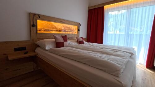 Katil atau katil-katil dalam bilik di Ferienwohnungen Starchenthof - Wildschönau, Premiumcard inclusive