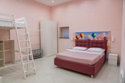 a bedroom with a bunk bed and a ladder at La Stella dei venti in Vico Equense