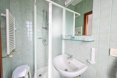 a bathroom with a sink and a shower at Av Isola Verde Hotel Thermal Spa in Ischia